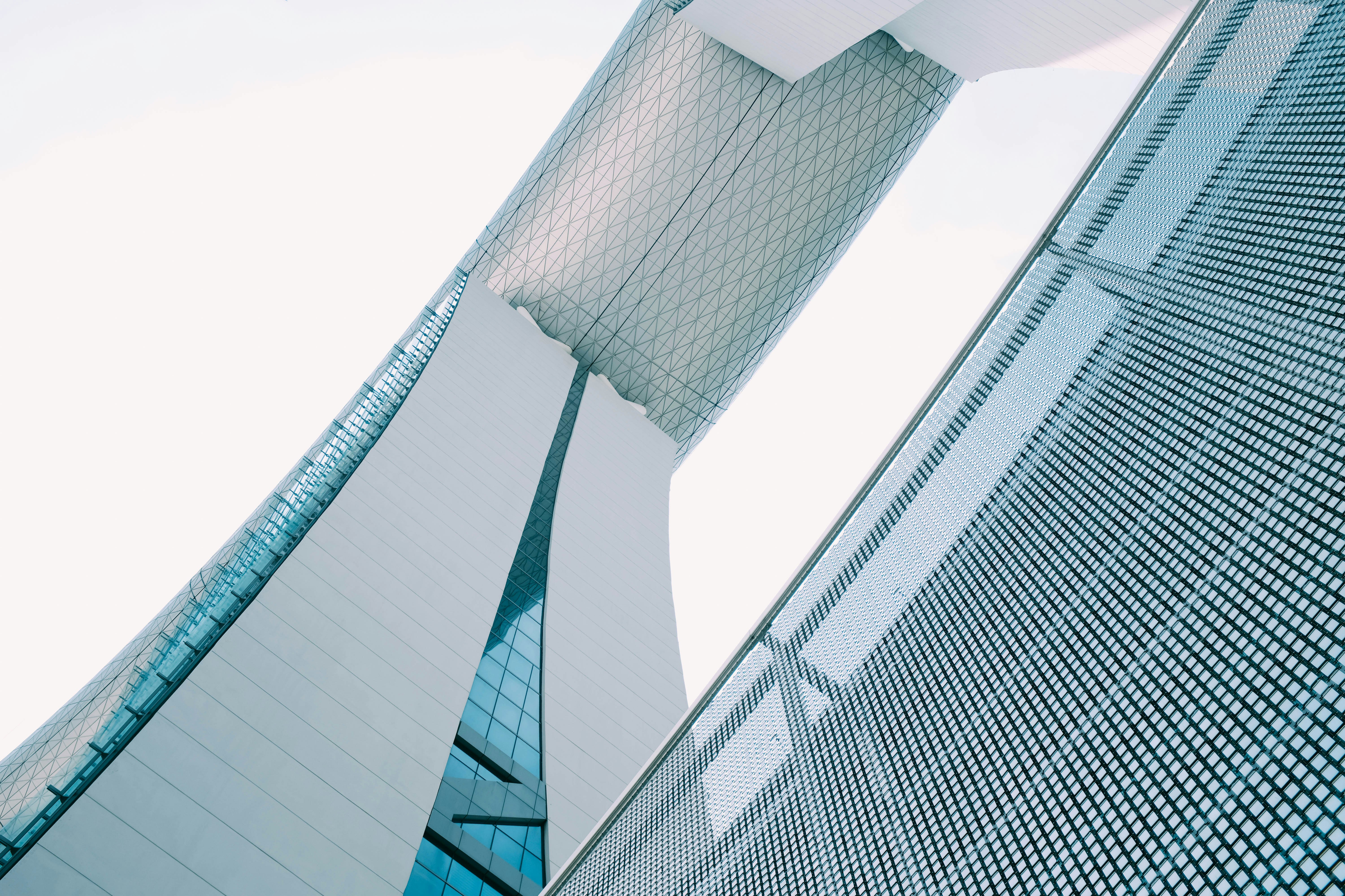 person showing white concrete building